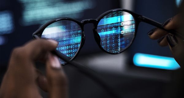 Image of pair of glasses with binary numbers projected on the lenses