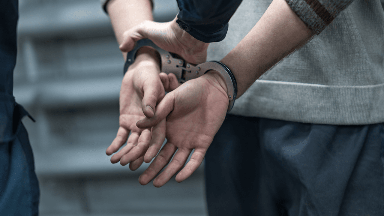 Individual in handcuffs