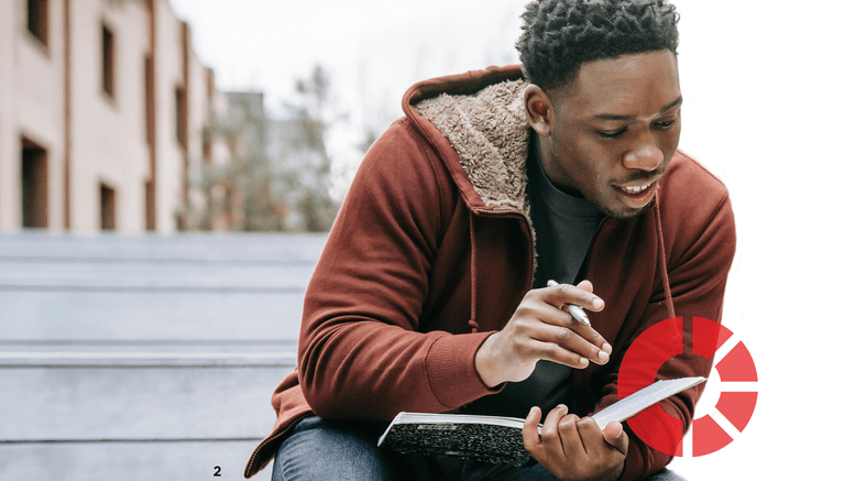 Male student looking through a study book