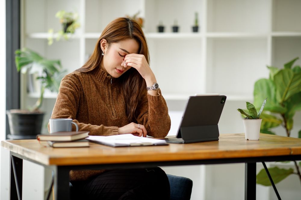 Image of woman in front of laptop