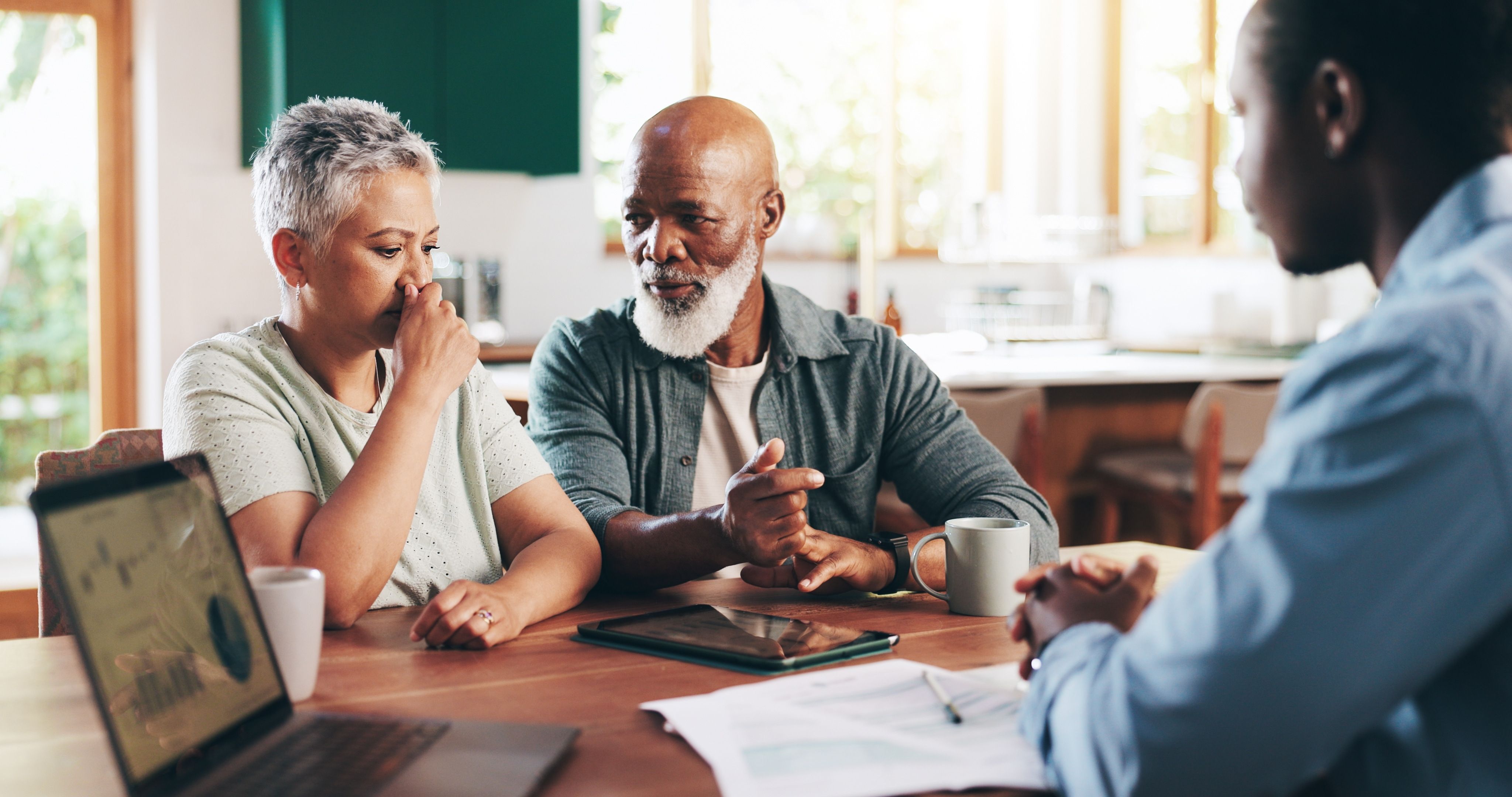 Elderly couple speaking with an advisor