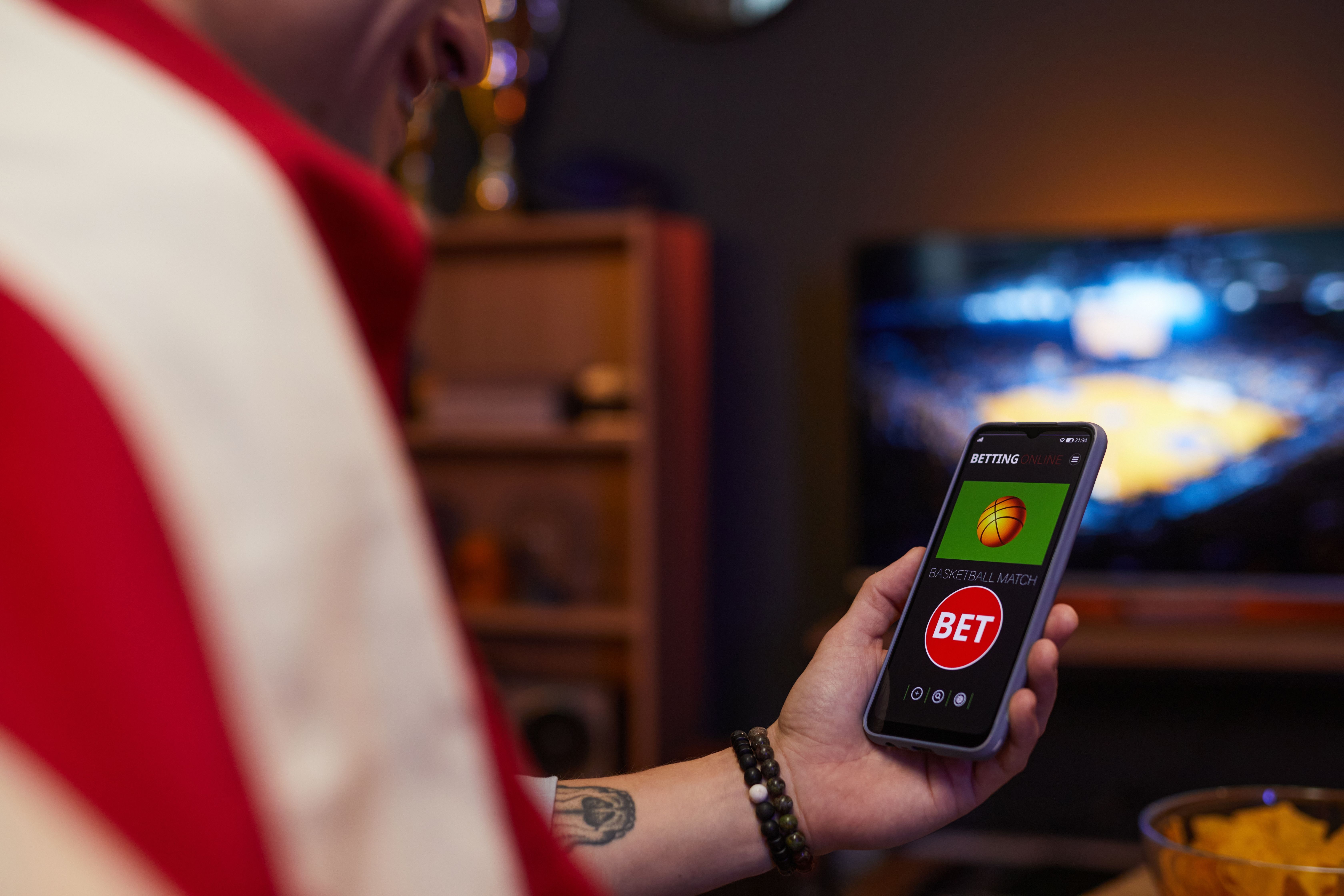 Watching Basketball Match on Smartphone Screen While Betting