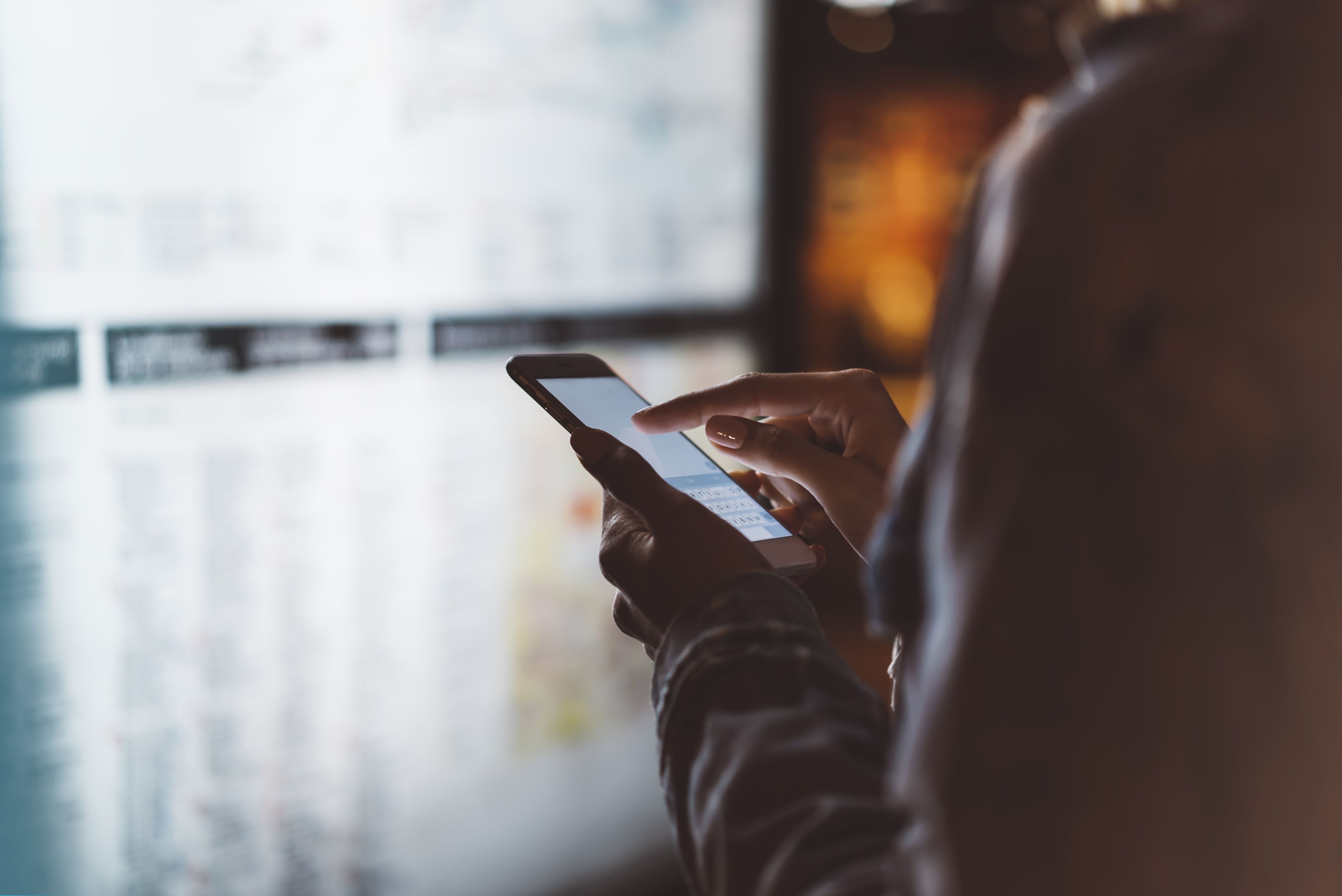 Person on mobile phone in office environment